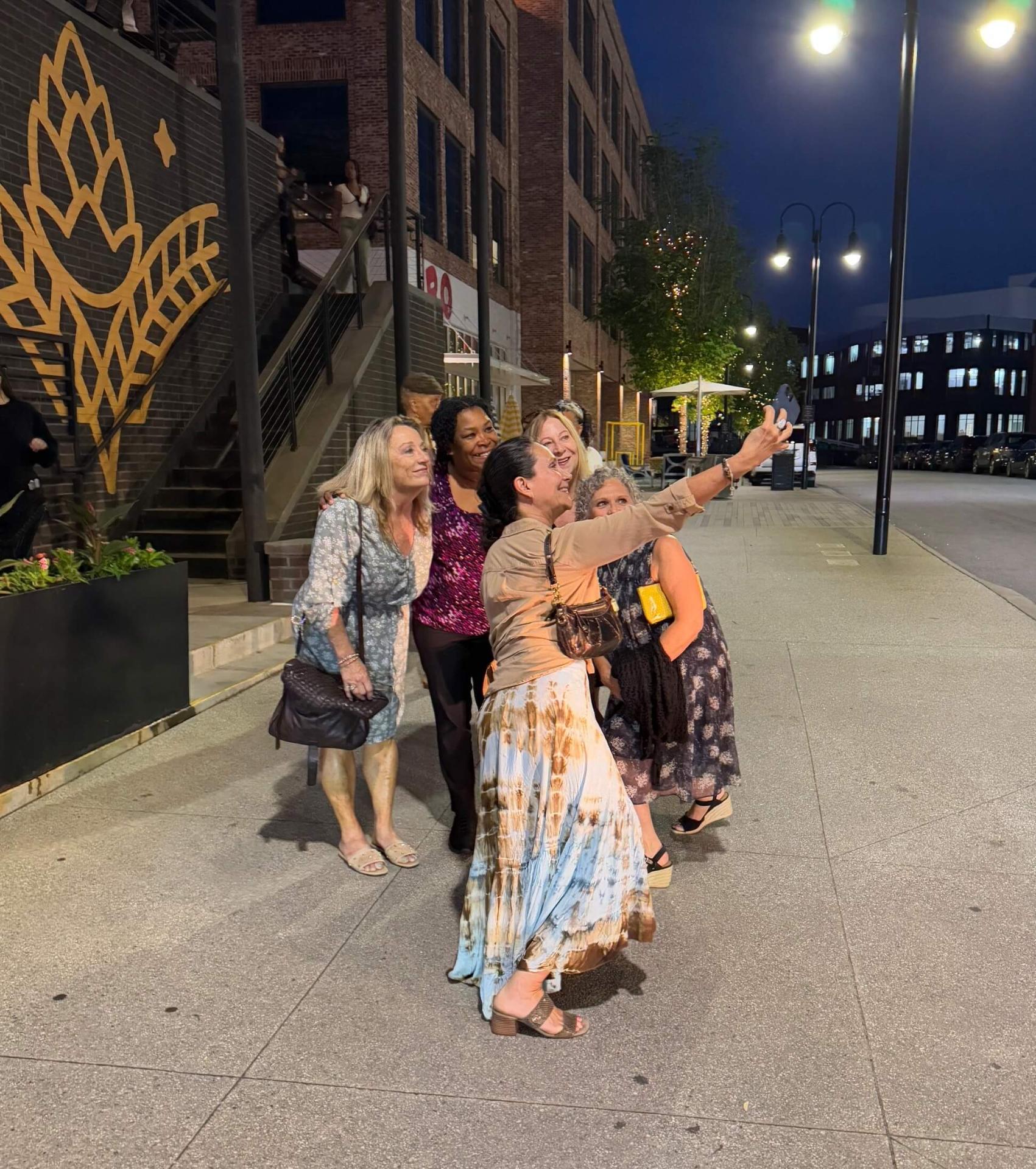 Women taking a selfie on a night out in Trilith
